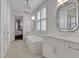 Stylish bathroom features a modern soaking tub, and vanity, and neutral color palette at 2620 Middle Coray Cir, Marietta, GA 30066