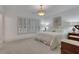 This bedroom features a bright interior, a bed with many pillows, and a vintage nightstand at 2620 Middle Coray Cir, Marietta, GA 30066