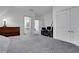 The bedroom features a workstation, and en-suite bathroom, and neutral color palate at 2620 Middle Coray Cir, Marietta, GA 30066