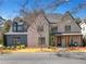 Beautiful two-story brick home with a covered front porch and a well-manicured lawn at 2620 Middle Coray Cir, Marietta, GA 30066