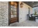 Welcoming front porch featuring brick flooring, a stylish front door, and comfortable seating at 2620 Middle Coray Cir, Marietta, GA 30066