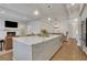 Open kitchen and living area with hardwood floors and fireplace at 2620 Middle Coray Cir, Marietta, GA 30066