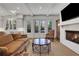 Inviting living room featuring a fireplace and access to a private outdoor jacuzzi at 2620 Middle Coray Cir, Marietta, GA 30066