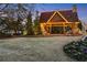 The outdoor pavilion is lit with string lights and is framed by landscaping and a large lawn at 2620 Middle Coray Cir, Marietta, GA 30066
