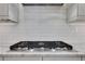 Modern kitchen stove top with subway tile backsplash at 2620 Middle Coray Cir, Marietta, GA 30066