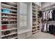 Custom walk-in closet with ample shelving and hanging space for organization and storage at 2620 Middle Coray Cir, Marietta, GA 30066