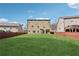 Spacious, level backyard enclosed by a wooden fence, offering plenty of room for recreation at 3400 Palmer Lake Pointe, Douglasville, GA 30135