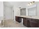 Spacious bathroom with double vanity, stone countertops, and tiled floors at 3400 Palmer Lake Pointe, Douglasville, GA 30135