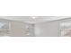 Bright, empty bedroom with three windows offering ample natural light and neutral walls at 3400 Palmer Lake Pointe, Douglasville, GA 30135