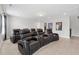 A home theater room featuring black leather recliners and framed movie posters on the wall at 3400 Palmer Lake Pointe, Douglasville, GA 30135