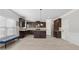 Modern kitchen featuring dark cabinets, stainless steel appliances, granite countertops, and a spacious center island at 3400 Palmer Lake Pointe, Douglasville, GA 30135