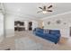 Open-concept living room with a view of the kitchen, featuring comfortable seating and natural light at 3400 Palmer Lake Pointe, Douglasville, GA 30135