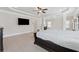 Expansive main bedroom with tray ceilings, dark furniture, and hardwood floors at 3400 Palmer Lake Pointe, Douglasville, GA 30135