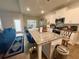 Well-equipped kitchen with stainless steel appliances, granite countertops, and bright white cabinets at 8325 Loch Lomand Ln, Winston, GA 30187