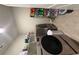 Well-organized laundry room with modern washer/dryer units and ample storage shelving at 8325 Loch Lomand Ln, Winston, GA 30187