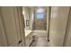 Functional bathroom with a tub/shower combination, white vanity, and neutral decor at 188 Foxtail Rd, Woodstock, GA 30188