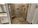 Modern bathroom showcasing a glass-enclosed shower with tiled walls and built-in seat at 188 Foxtail Rd, Woodstock, GA 30188