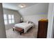 Comfortable bedroom featuring natural light, neutral walls, and carpeted floors at 188 Foxtail Rd, Woodstock, GA 30188