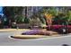 Stone community entrance with landscaping and flower beds at 188 Foxtail Rd, Woodstock, GA 30188