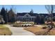 Beautiful community clubhouse exterior surrounded by lush landscaping and walking paths at 188 Foxtail Rd, Woodstock, GA 30188
