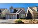 Charming brick-and-siding home featuring an attached two-car garage and well-maintained landscaping at 188 Foxtail Rd, Woodstock, GA 30188