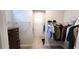 Spacious walk-in closet with ample storage and custom shelving and racks at 188 Foxtail Rd, Woodstock, GA 30188