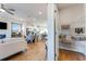 Open-concept living space with a modern kitchen, dining area, and a walk-in pantry at 301 Oldvine Dr, Lawrenceville, GA 30044