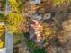 Aerial view showcases the home's landscaped yard, stone patios, and outdoor spaces at 3672 Howell Wood Nw Trl, Duluth, GA 30096