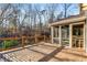 A deck provides outdoor living space and a view of the wooded backyard of the home at 3672 Howell Wood Nw Trl, Duluth, GA 30096