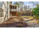 Exterior showcasing a screened porch, wooden deck with stairs, walkout basement, and stone landscaping at 3672 Howell Wood Nw Trl, Duluth, GA 30096