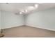 Spacious basement with neutral paint and lighting, ideal for various uses and personalization at 3672 Howell Wood Nw Trl, Duluth, GA 30096