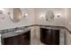 Bathroom with dual sink vanities, granite countertops, and mosaic tile accents at 3672 Howell Wood Nw Trl, Duluth, GA 30096