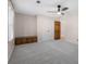 Carpeted bedroom features storage bench, a window, a ceiling fan, and access to ensuite bathroom at 3672 Howell Wood Nw Trl, Duluth, GA 30096