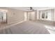 Spacious bedroom with plush carpeting, neutral walls, and a large window with built-in bench at 3672 Howell Wood Nw Trl, Duluth, GA 30096