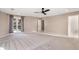 Spacious bedroom with plush carpeting, neutral walls, and a large window for natural light at 3672 Howell Wood Nw Trl, Duluth, GA 30096