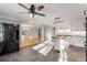 Modern kitchen with stainless steel appliances, a kitchen island, and an open layout connected to the living area at 3672 Howell Wood Nw Trl, Duluth, GA 30096