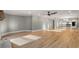 A spacious living room features hardwood floors, recessed lighting, and an open floor plan with easy access to the kitchen at 3672 Howell Wood Nw Trl, Duluth, GA 30096