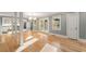 Open-concept living area with hardwood floors, offering abundant natural light with views to the kitchen and outdoor areas at 3672 Howell Wood Nw Trl, Duluth, GA 30096