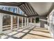 Screened porch with vaulted ceiling and view of backyard woods providing a peaceful outdoor setting at 3672 Howell Wood Nw Trl, Duluth, GA 30096