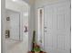 Bright entryway featuring a white front door with sidelight and views into other rooms at 507 Mockingbird Ln, Loganville, GA 30052