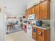 Efficient kitchen layout with modern appliances, plenty of cabinet space, and adjacent dining area at 507 Mockingbird Ln, Loganville, GA 30052