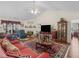 Spacious living room boasts vaulted ceilings, fireplace, and seamless flow to the dining area at 507 Mockingbird Ln, Loganville, GA 30052