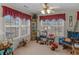 Bright sun room with large windows, ideal for reading or relaxing while enjoying the view at 507 Mockingbird Ln, Loganville, GA 30052