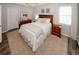 Bright bedroom featuring a queen-sized bed, wood floors, and neutral walls at 70 Oaklake Dr, Covington, GA 30016
