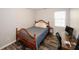 Comfortable bedroom with wood-look floors and a desk area by the window at 70 Oaklake Dr, Covington, GA 30016