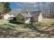 View of home featuring a sunroom and backyard at 70 Oaklake Dr, Covington, GA 30016
