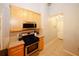 Kitchen with stainless steel range, microwave and tile backsplash at 70 Oaklake Dr, Covington, GA 30016
