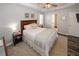 Serene main bedroom with tray ceiling, en-suite bath, and soft natural light at 70 Oaklake Dr, Covington, GA 30016