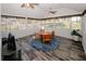 Bright sun room with panoramic windows and wood flooring at 70 Oaklake Dr, Covington, GA 30016