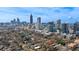 Stunning aerial view of property with city skyline backdrop on a bright, sunny day at 907 Piedmont Ne Ave # 7, Atlanta, GA 30309